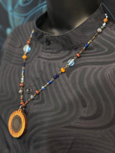 4-Wood Circle Pendant with Sodalite, Vintage, and Wood Beads